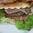 Panino hamburger cotto melanzane sott’olio e scaglie e lattuga